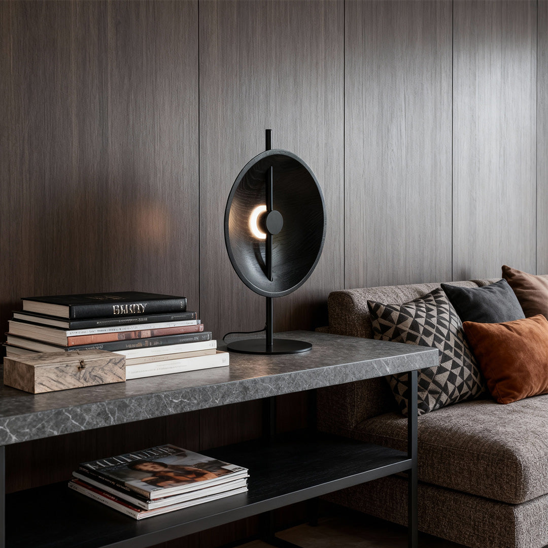 Dark wood circular table lamp adding warm tone to contemporary living room.