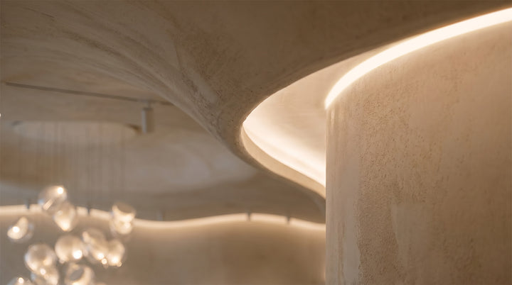 Outdoor embedded LED light strips illuminating modern staircase edges with warm, ambient glow.