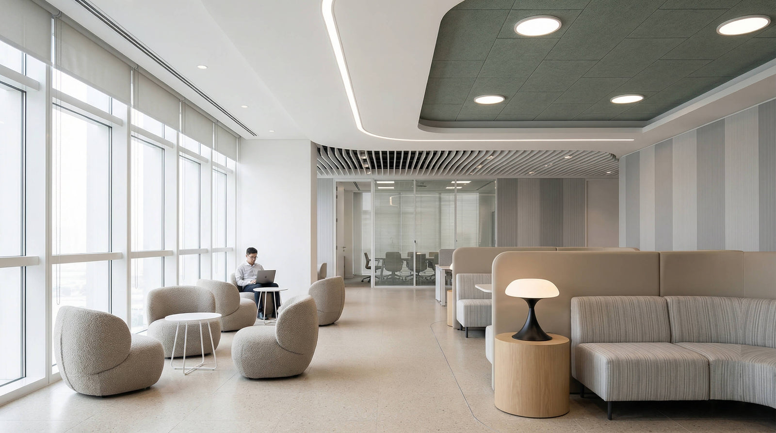 Circular pendant light in a private office meeting room, showing restrained scale for business interiors