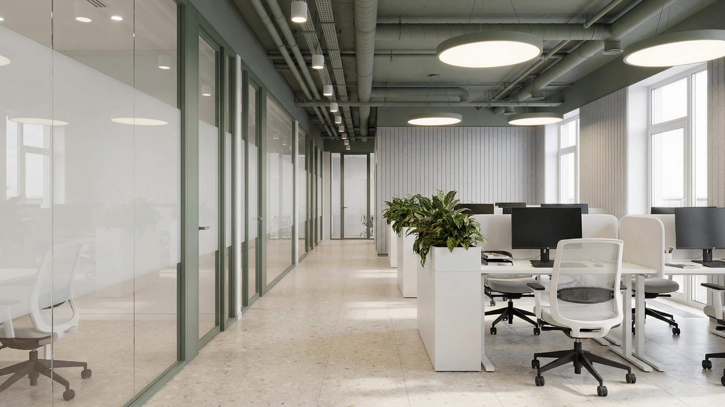 Modern meeting room with round pendant lighting, showing proportion for four-to-six person tables