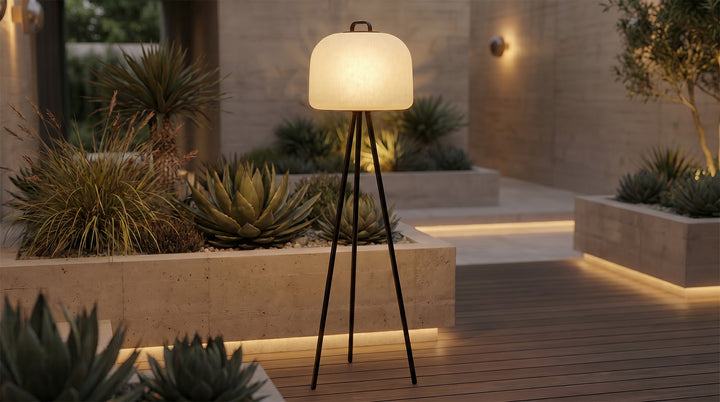 Garden pathway lit by waterproof outdoor floor lamps arranged near plants and steps.