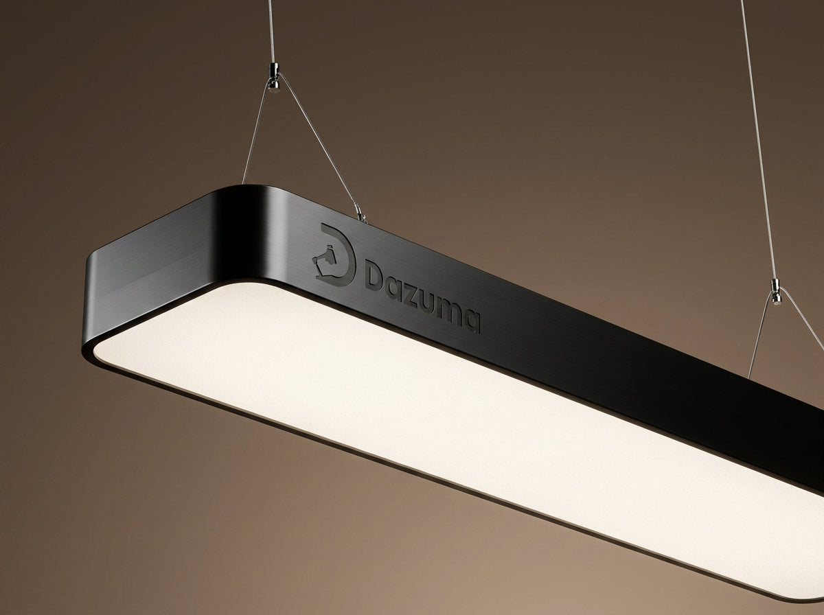 Modern minimalist black linear pendant light fixtures by Dazuma suspended with thin wires against a neutral background.