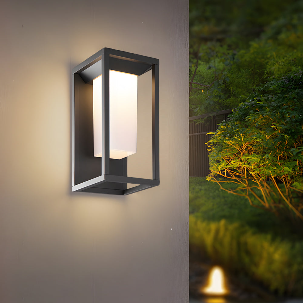 Sleek geometric wall light fixture illuminating modern exterior wall with soft warm glow