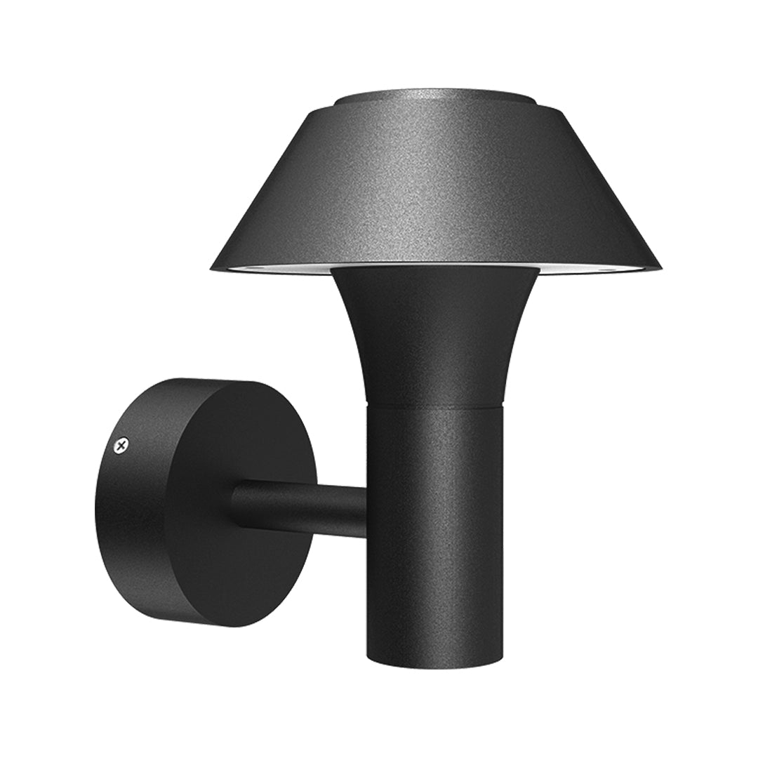 Modern black dome wall light with extending arm illuminating brick exterior wall at dusk