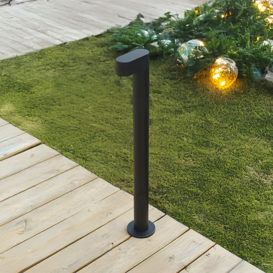 LED path light installation on wooden deck overlooking landscaped garden with evening ambiance