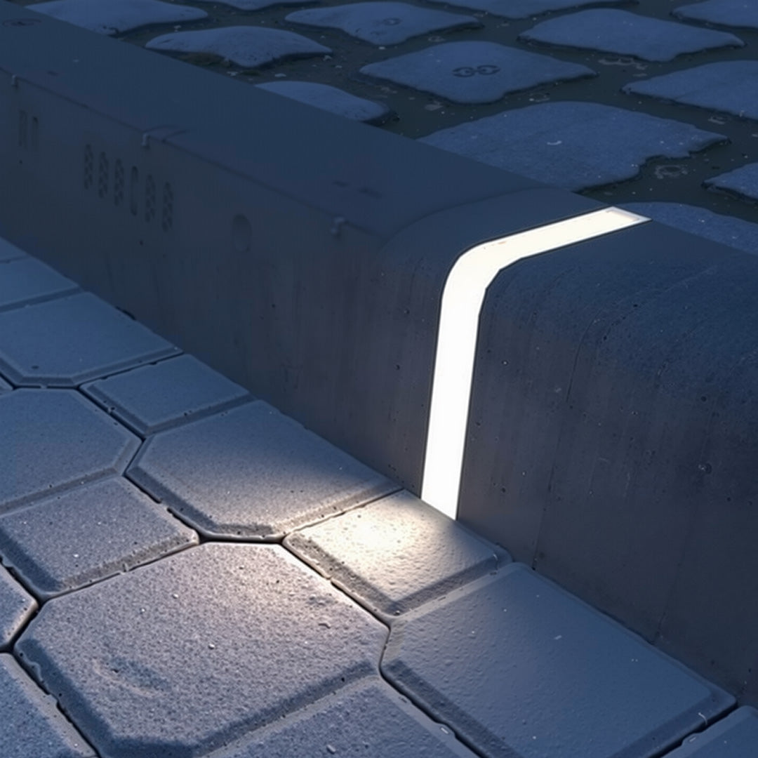 Deck lighting for steps embedded in paver edging creating soft directional lighting along outdoor hardscape