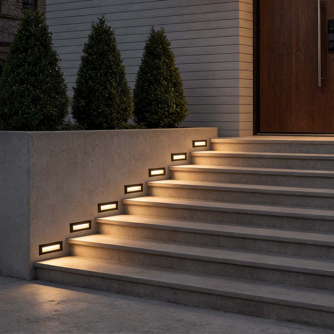 Deck lights for steps providing soft illumination along a garden staircase.