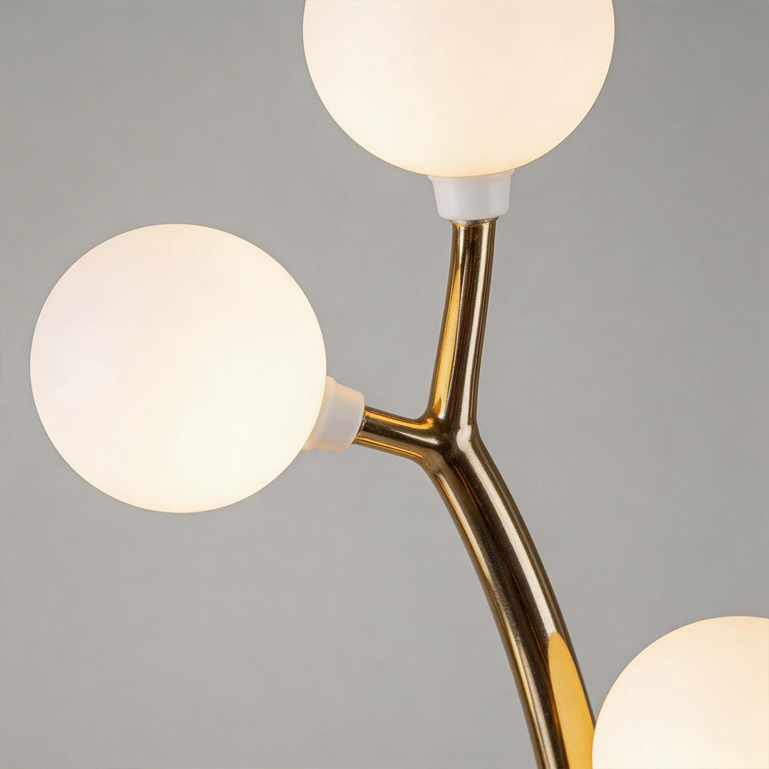 Close-up of decorate floor lamp showcasing its spherical lights and elegant branches.