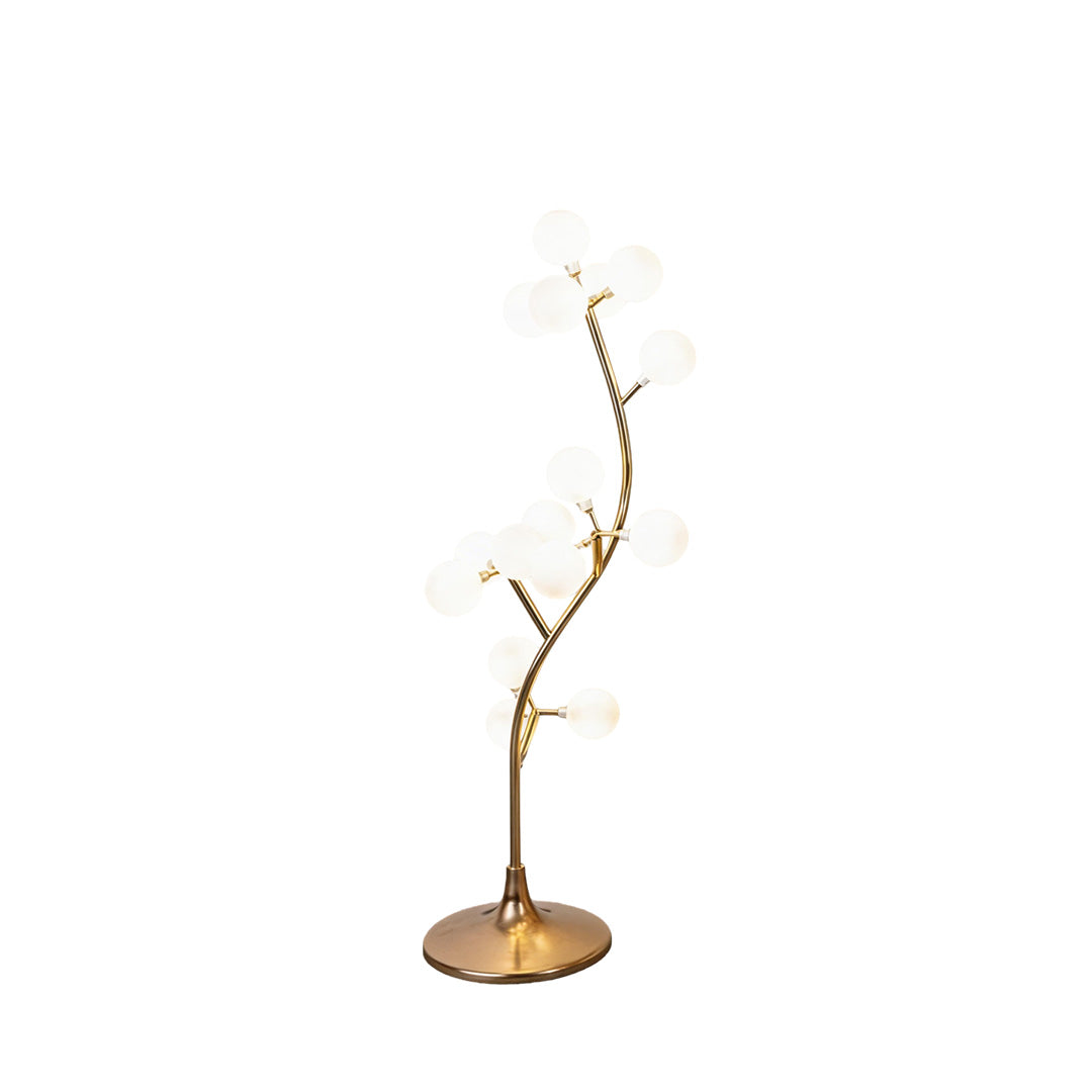Decorate floor lamp with a modern tree design, providing ambient lighting in a living space.