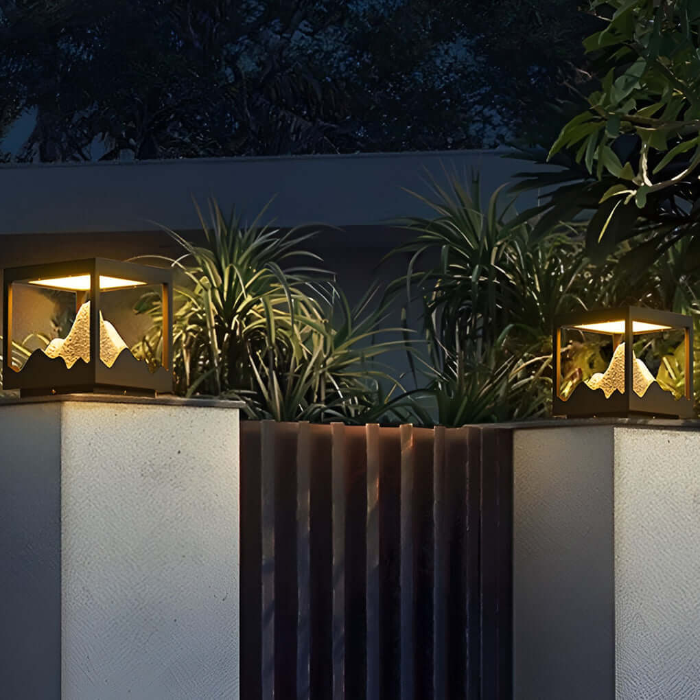 Decorate pillar light illuminating a modern fence with soft glow.
