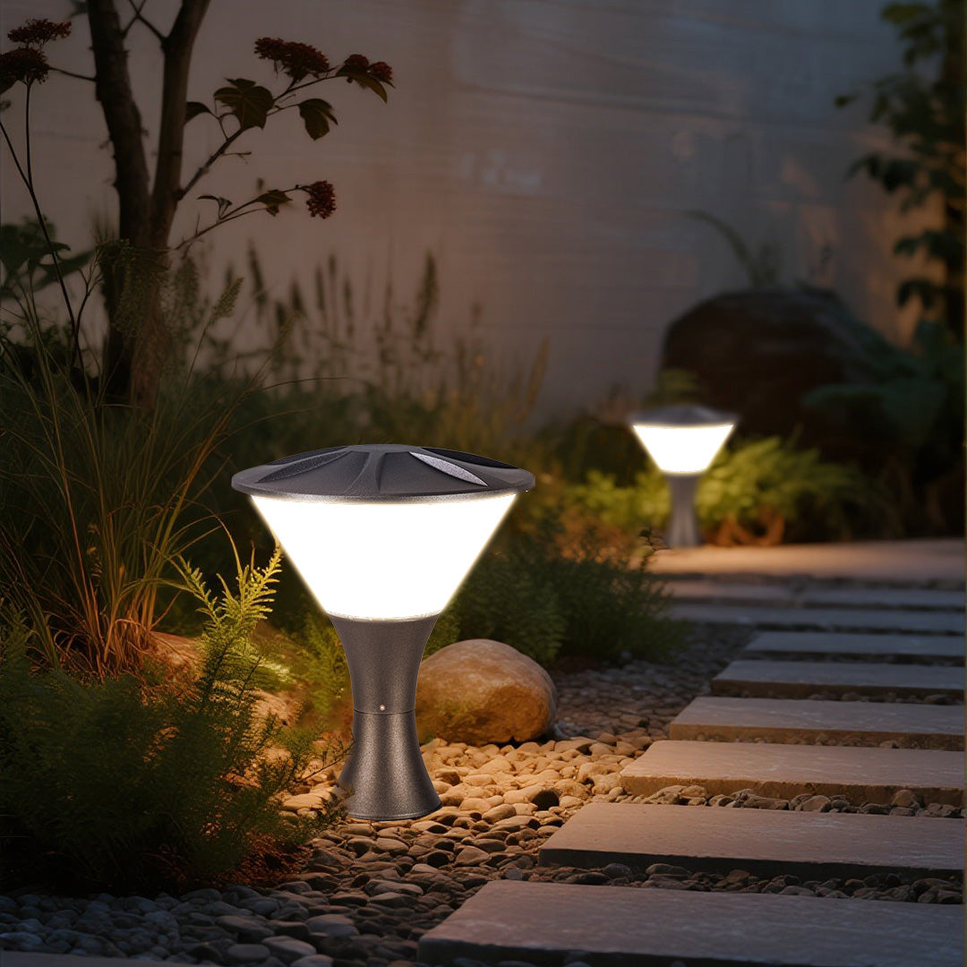 Decorative bollard light providing pathway illumination near swimming pool with ambient evening atmosphere