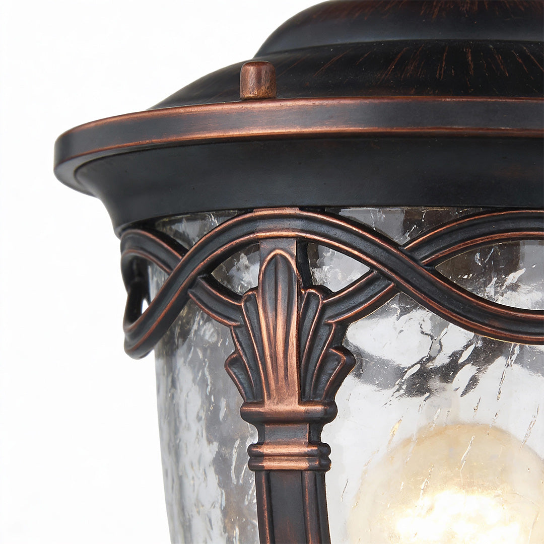 Decorative gate pillar light with intricate bronze frame and textured glass, perfect for stylish garden or gate lighting.