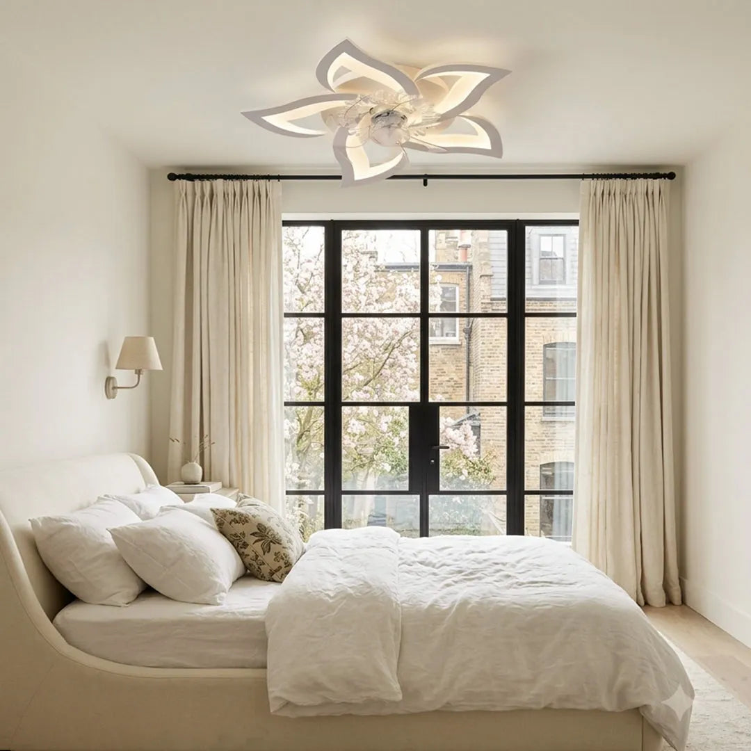 Decorative ceiling fan with lights in a modern bedroom showcasing a sculptural petal-style design and built-in illumination.