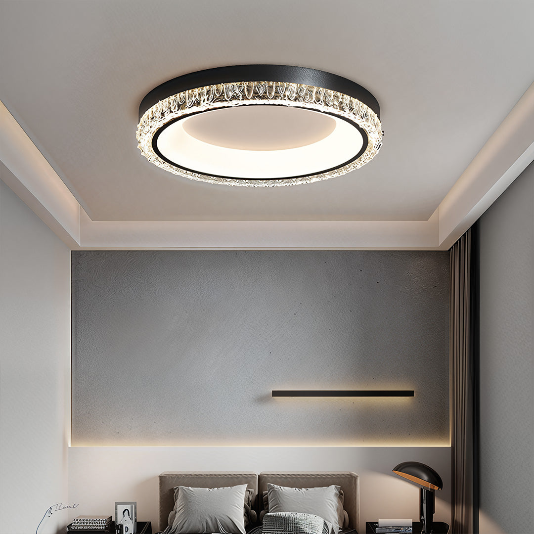 Decorative crystal trim on the white flush mount ceiling light, providing ambient and functional room illumination.