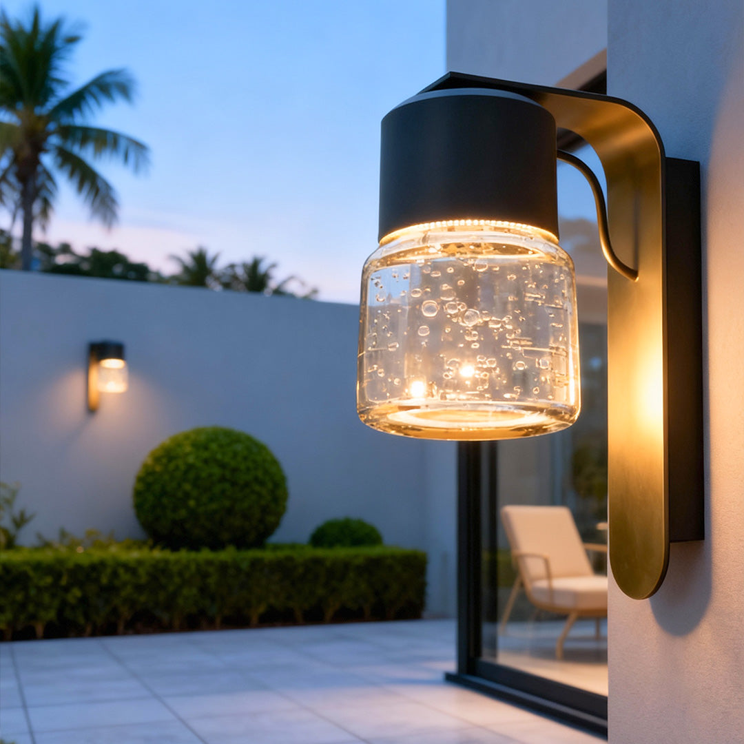 Decorative exterior wall mount lights enhancing outdoor ambiance in evening setting.
