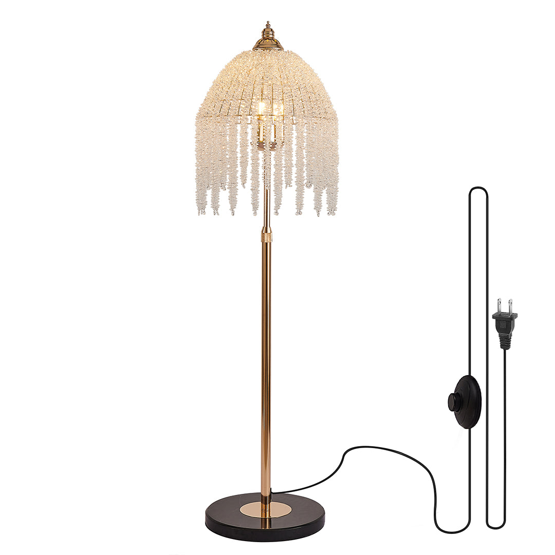 Luxury teardrop floor crystal lamps with golden base and hanging crystals, creating a sparkling and refined look.