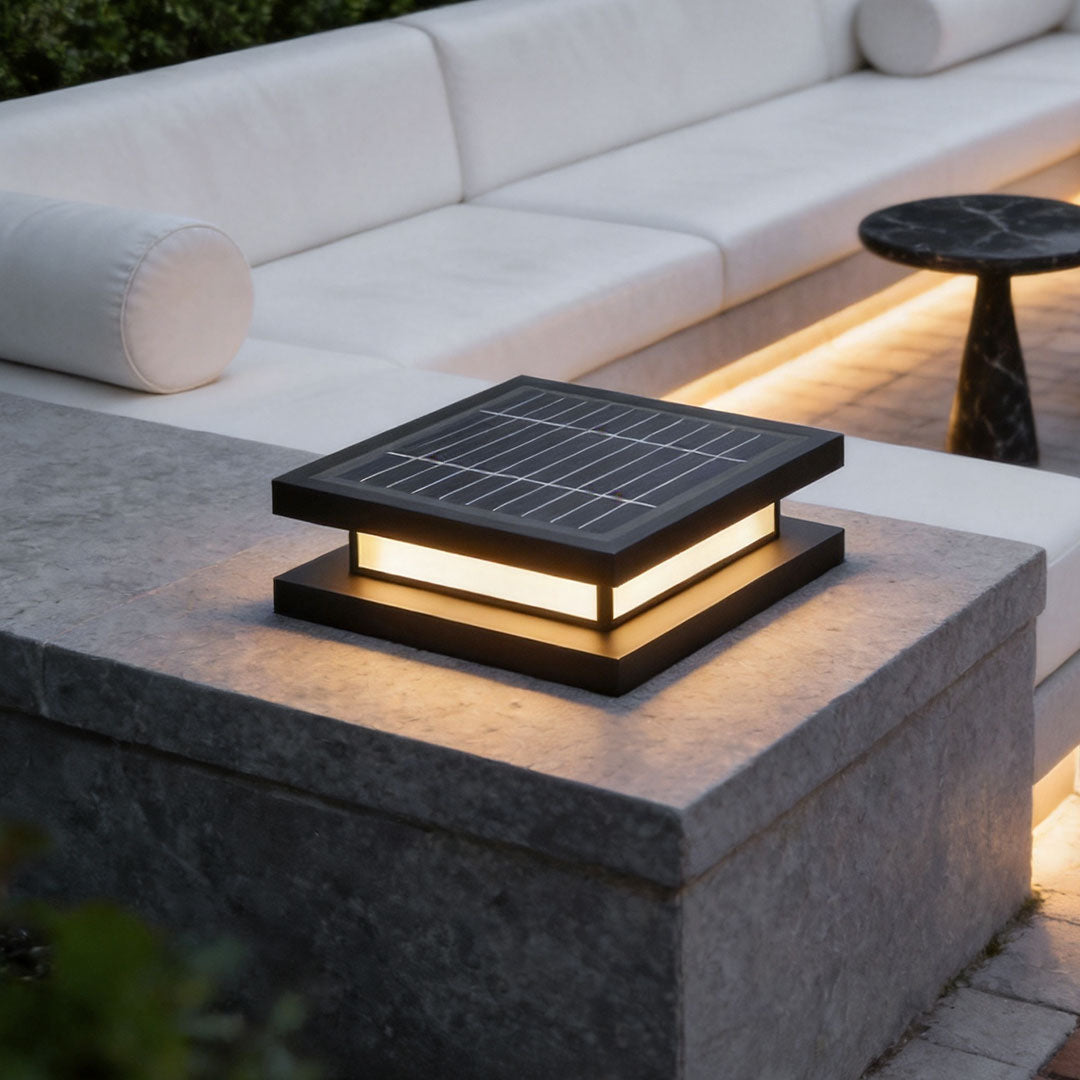 Close-up of decorative garden lights with integrated solar panel and modern black finish.