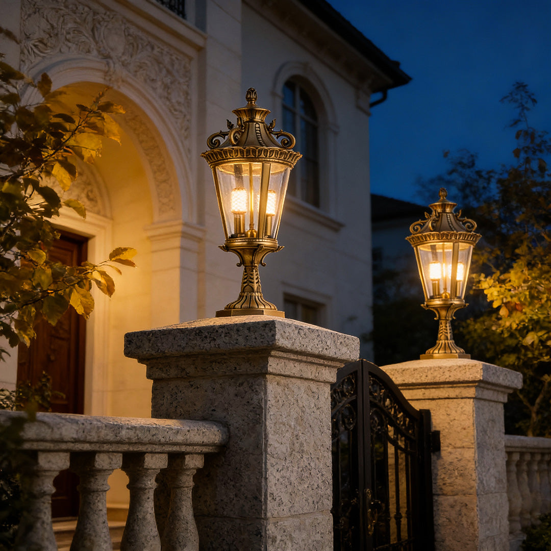 Decorative glass pillar lights on a stone wall, providing a warm glow for garden pathways and outdoor ambiance.