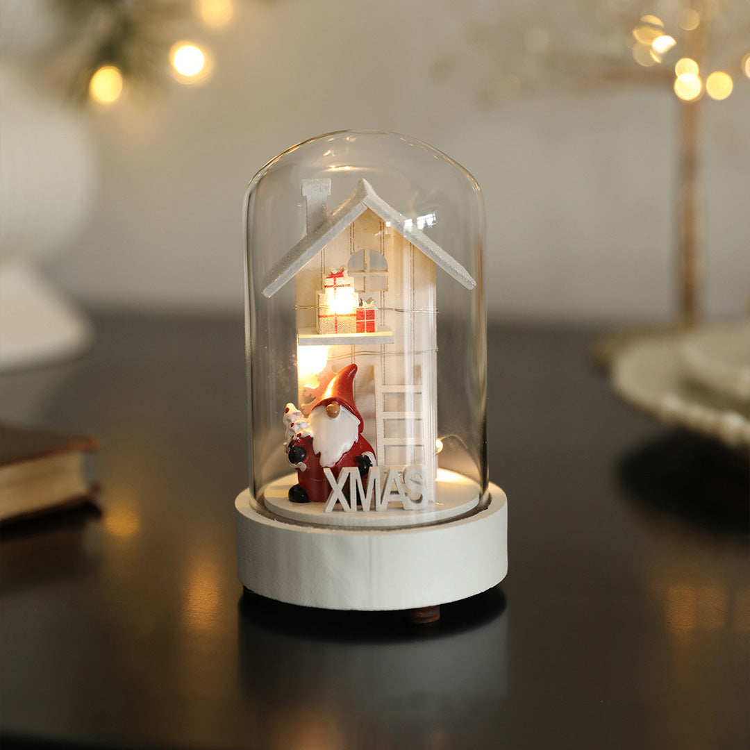 Decorative led table lamp displaying illuminated miniature arched house with warm glow in cozy interior setting