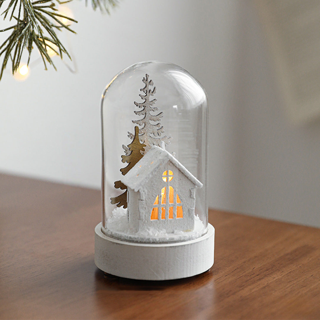 Decorative led table lamp showcasing illuminated church miniature with winter foliage under protective glass cover