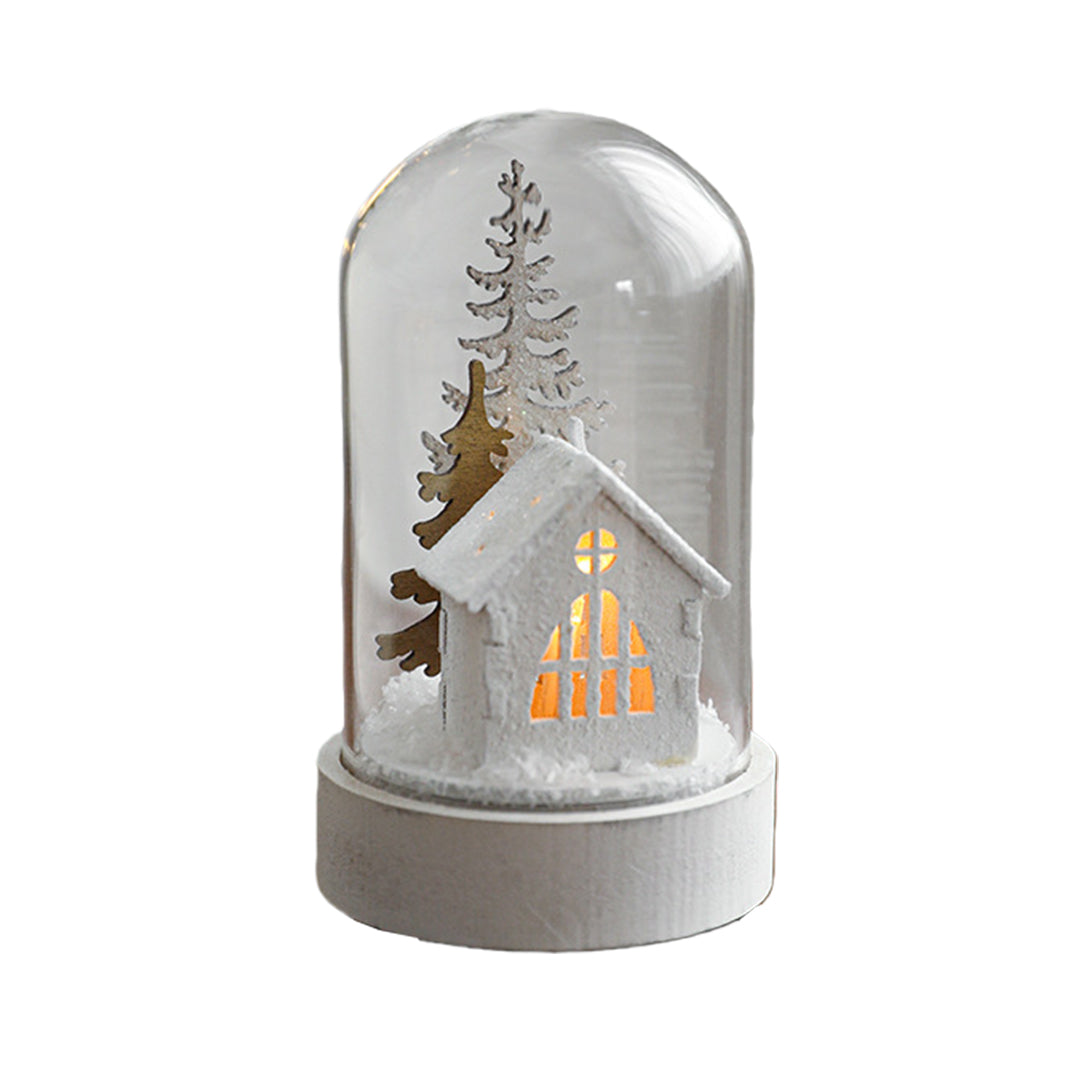 Decorative led table lamp with glass cloche displaying illuminated miniature church and winter woodland scene