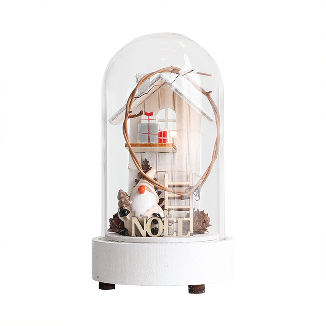 White decorative led table lamp with transparent dome containing vintage-style holiday scene with warm lighting