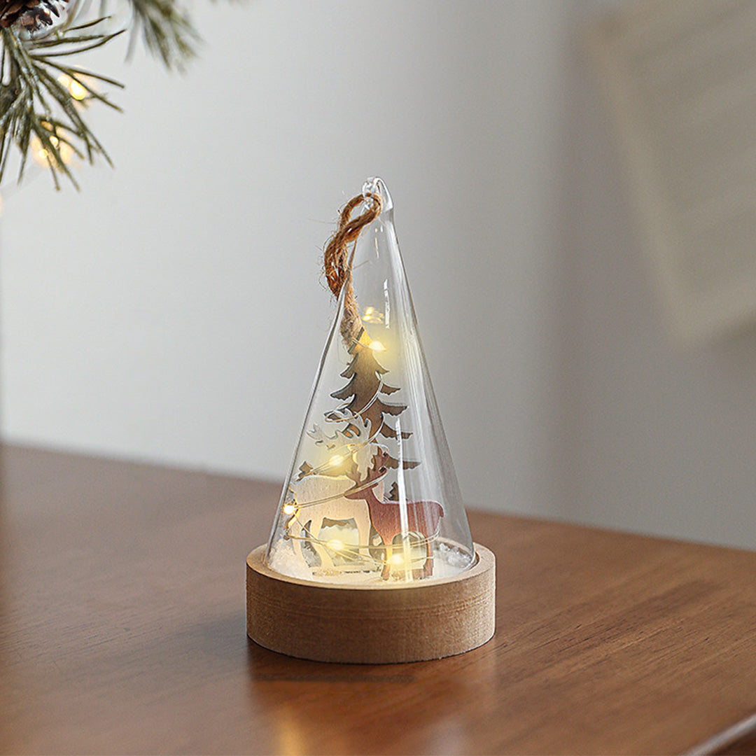 Decorative led table lamp with wooden base and glass dome displaying illuminated cone tree diorama scene