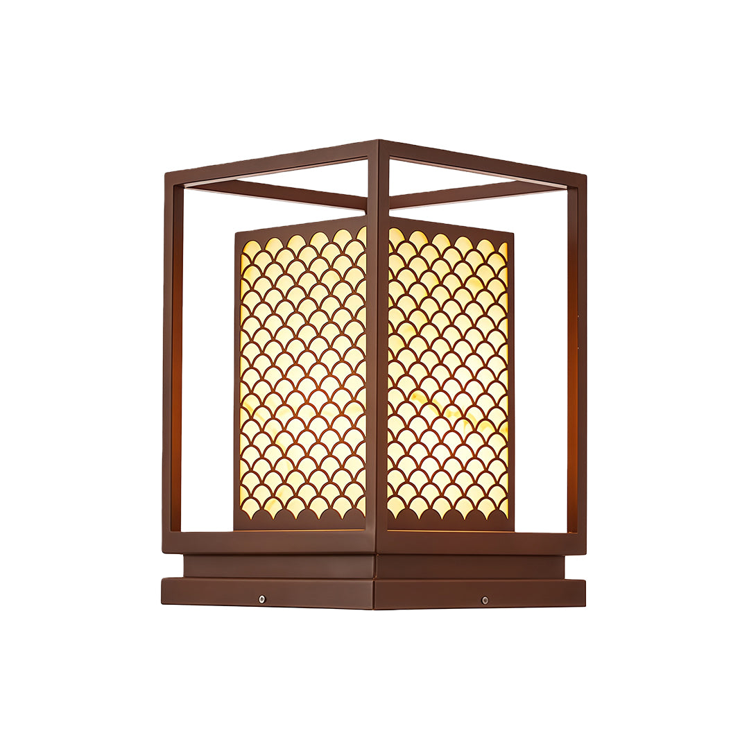 Bollard light with a decorative metal frame, offering elegant illumination along a garden path.