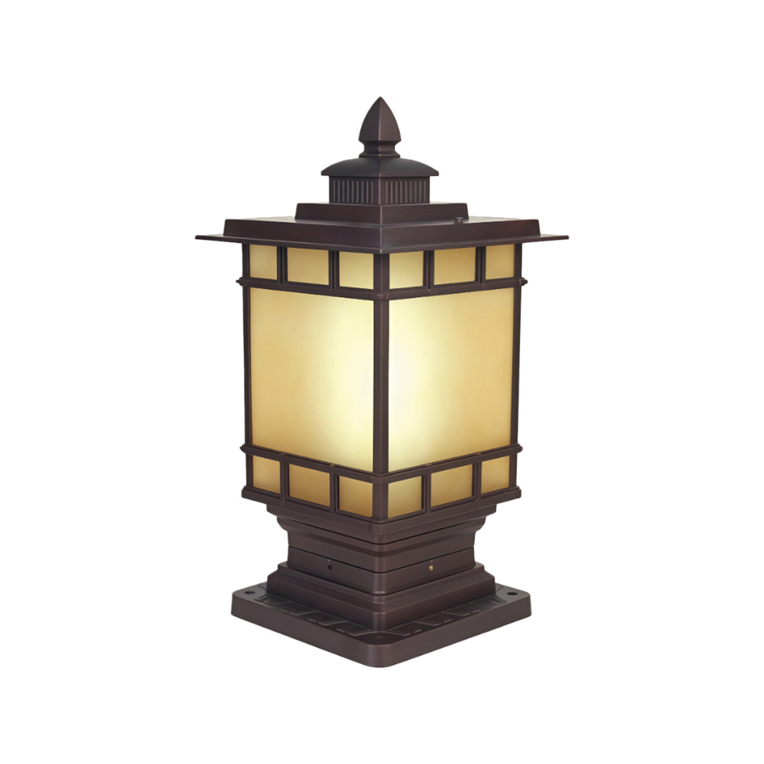 Decorative metal pillar light fixture featuring pagoda-style design with cream glass and dark metal frame