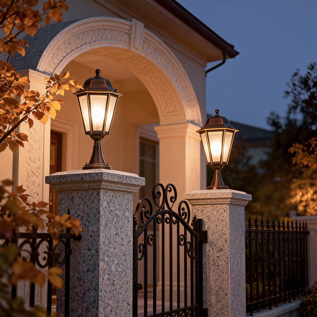 Decorative outdoor pillar light on stone fence, casting a welcoming glow for front yard or garden pathways.