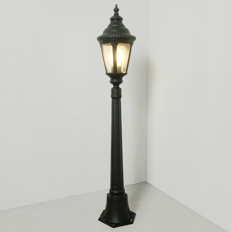 Decorative post light providing elegant illumination for a classic landscape.