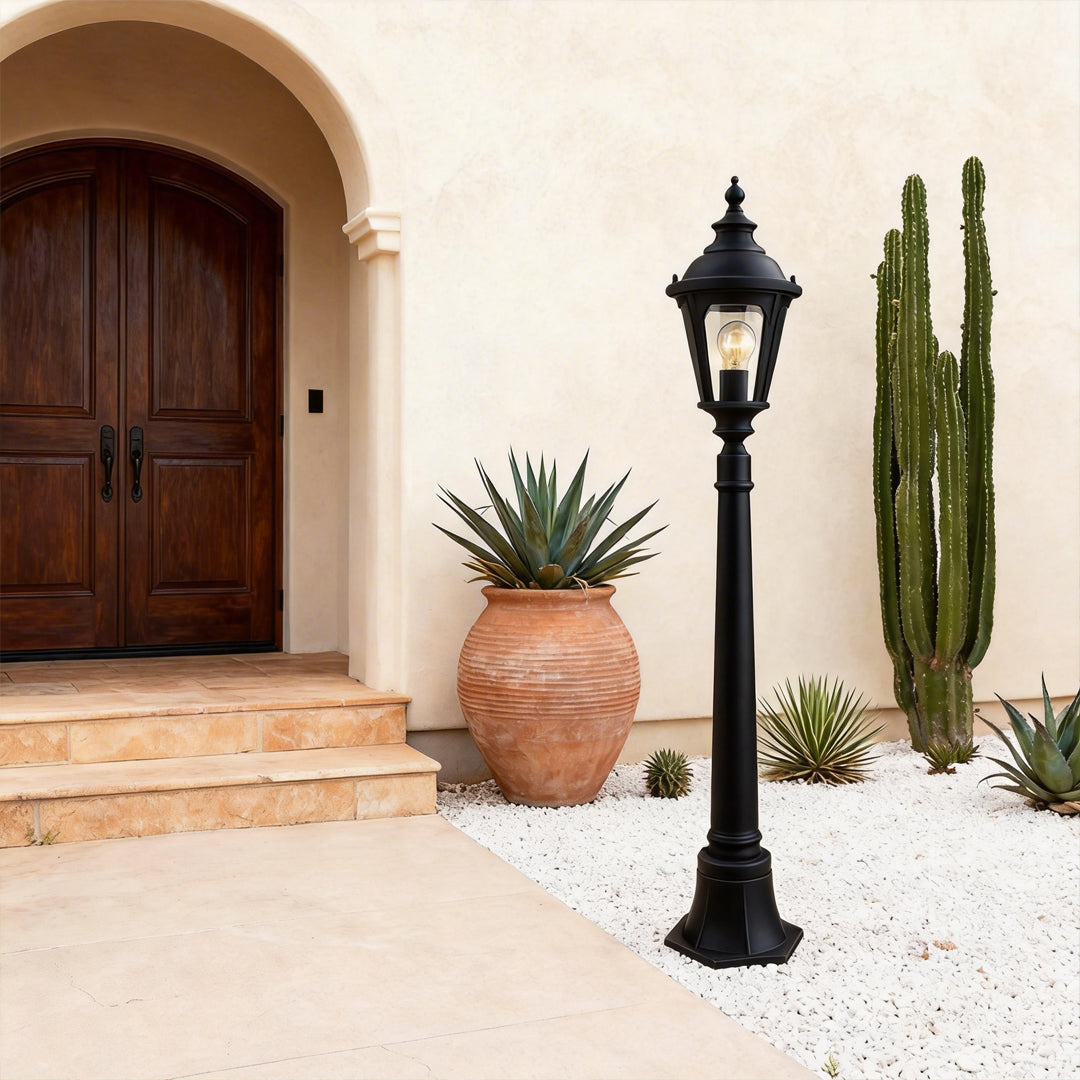 Decorative post light enhancing a contemporary outdoor seating area with warm light.