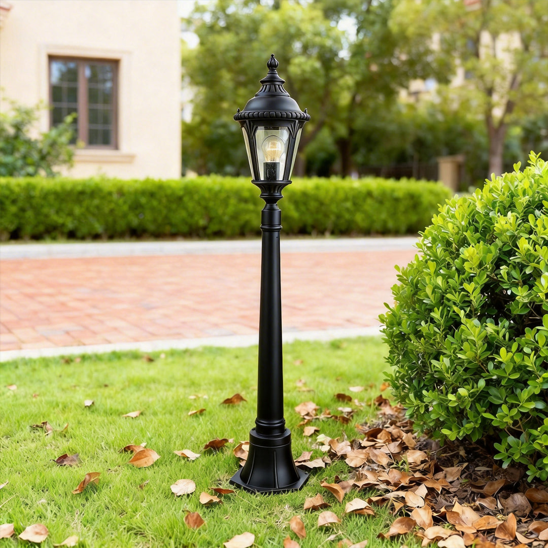 Decorative post light enhancing a modern house entrance with elegant ambient light.