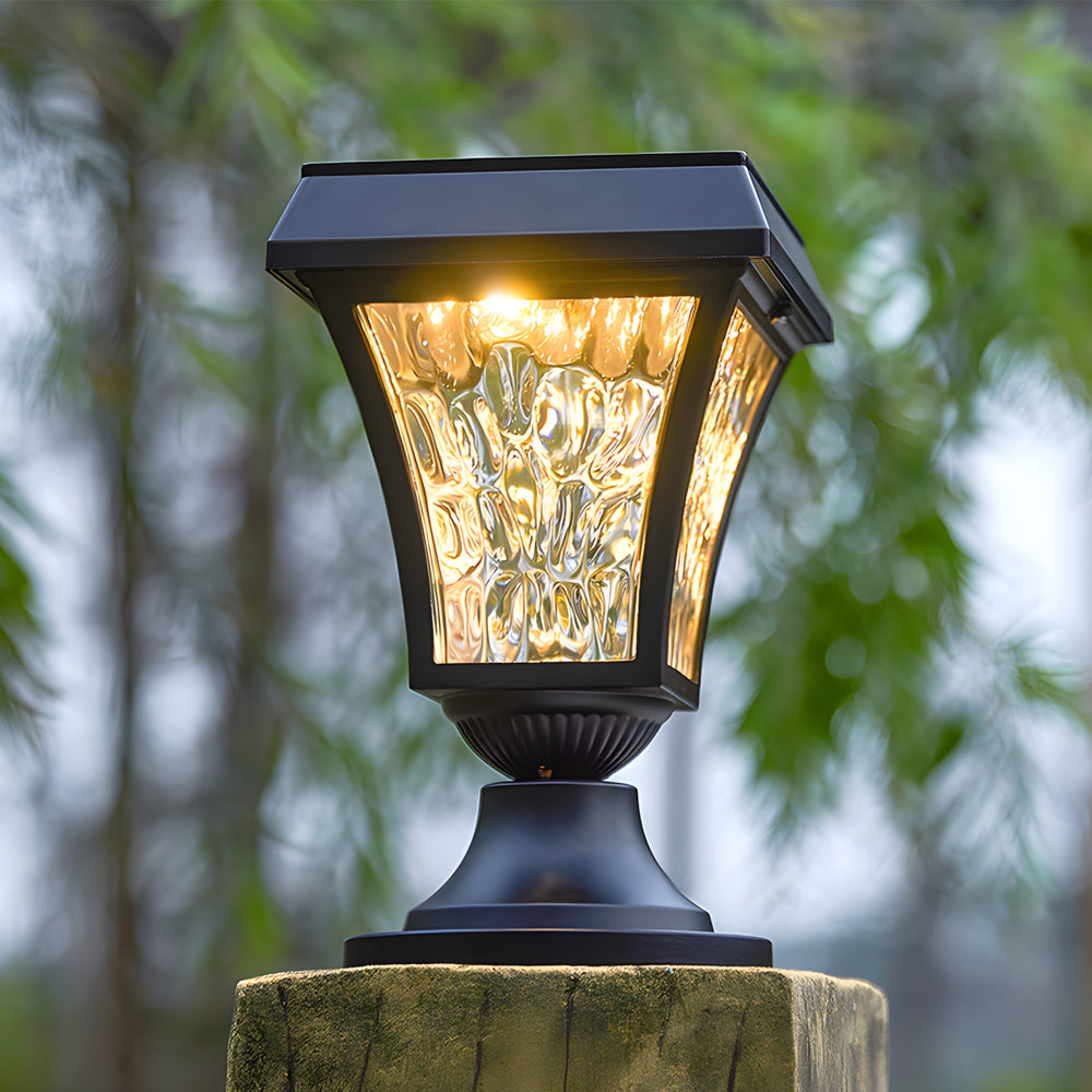 Decorative post light with textured glass shade mounted on stone pillar in garden setting