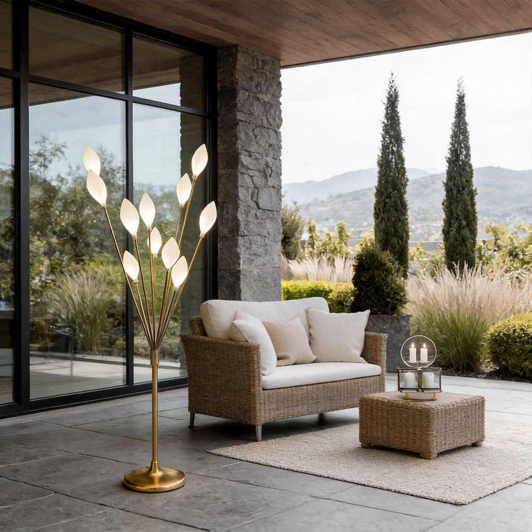 Decorator floor lamps with a stylish leaf design, illuminating a modern lounge with a sofa.