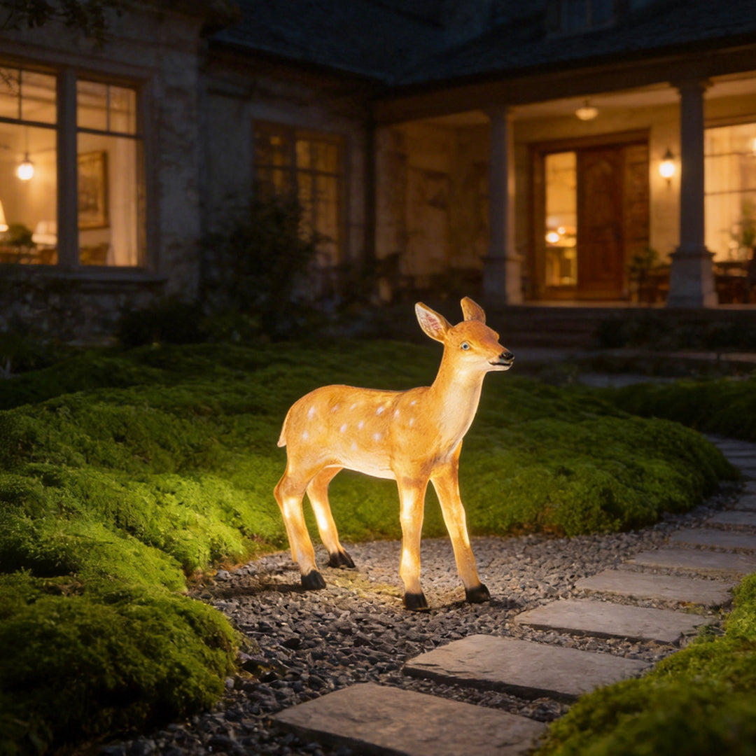Deer lights illuminating a modern garden pathway with lifelike deer silhouette.