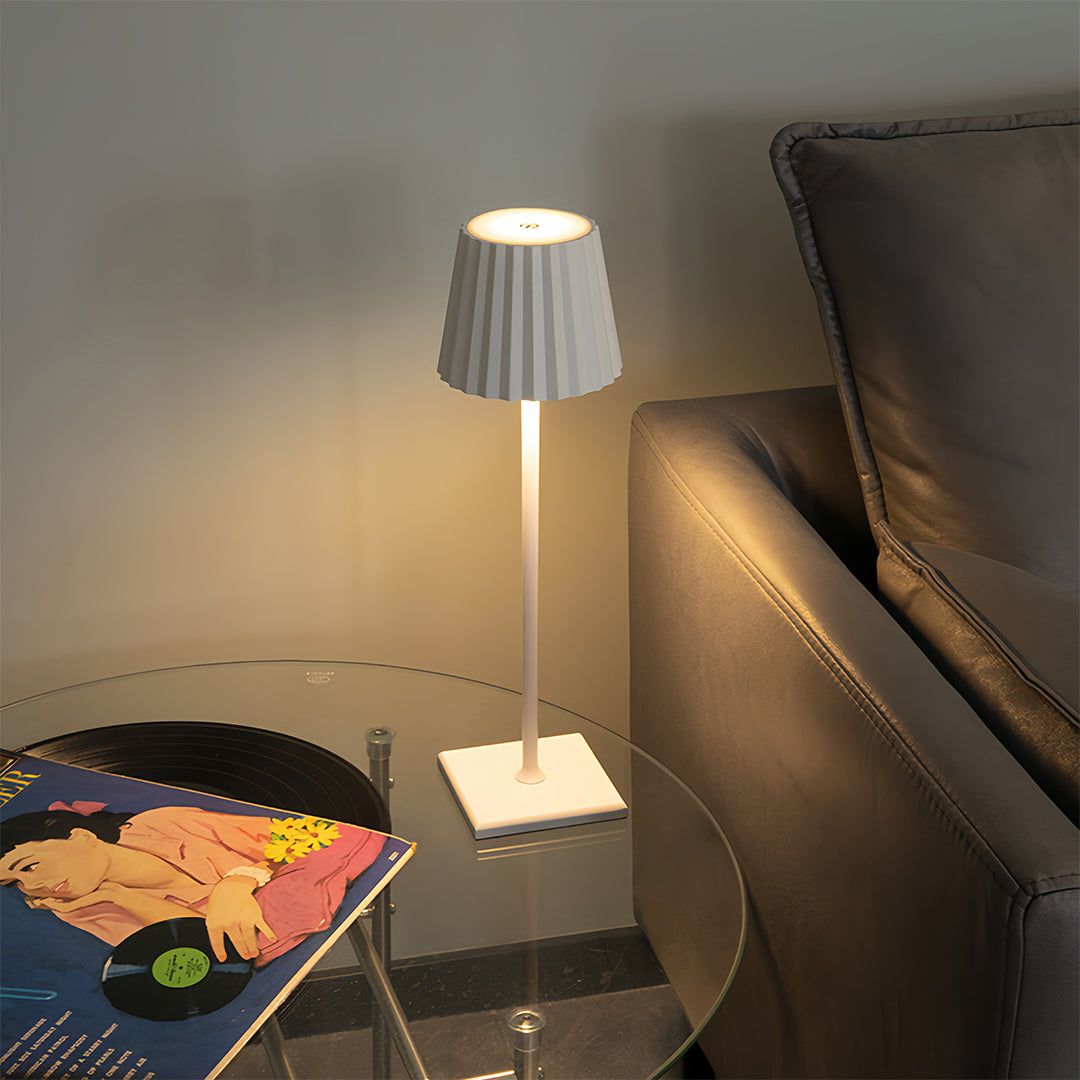 Designer modern metal table lamp with angular black shade offering sophisticated accent lighting