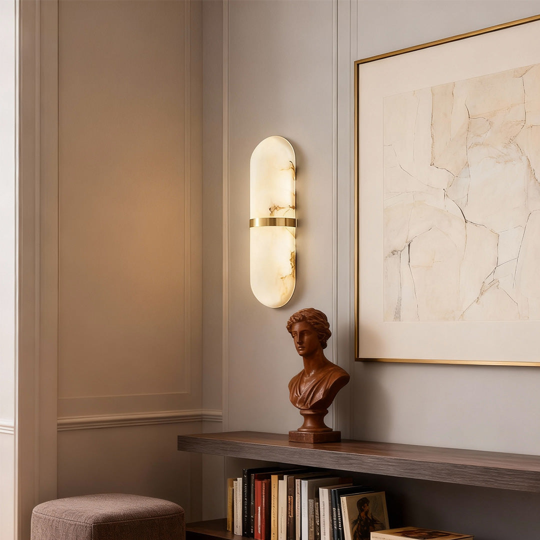 Designer art wall lighting featuring glass shade chandelier aesthetic creating warm glow beside bookshelf in minimalist interior.