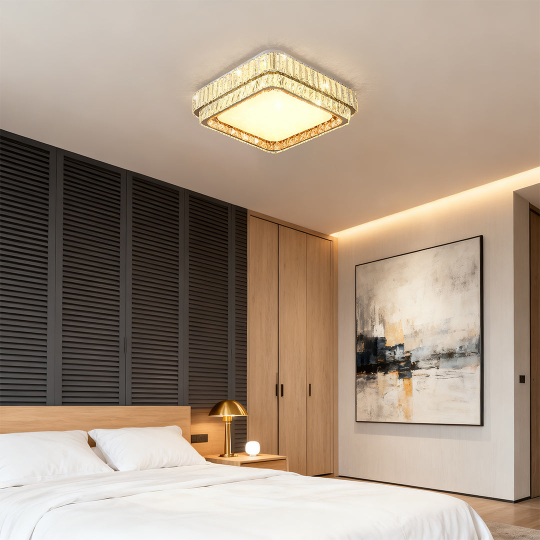 Designer contemporary flush mount lighting with glass shade chandelier styling illuminating modern bedroom with artistic wall decor.