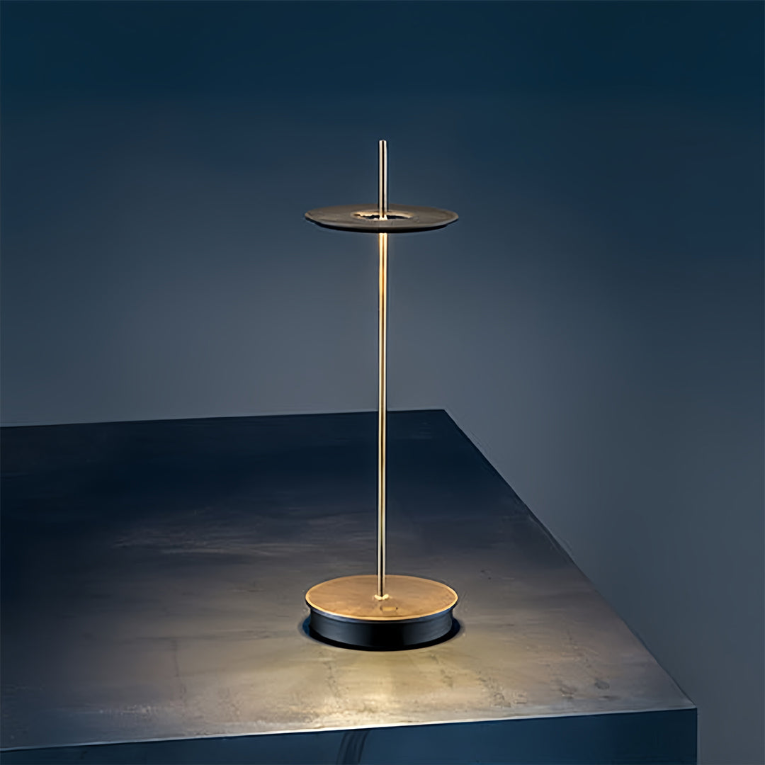 Designer dimmable table lamp with warm light creating cozy atmosphere in modern blue interior