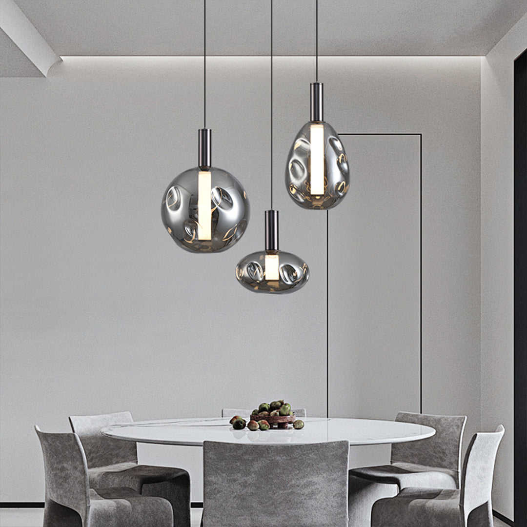 Designer drum pendant lights creating dramatic lighting effects in modern living space