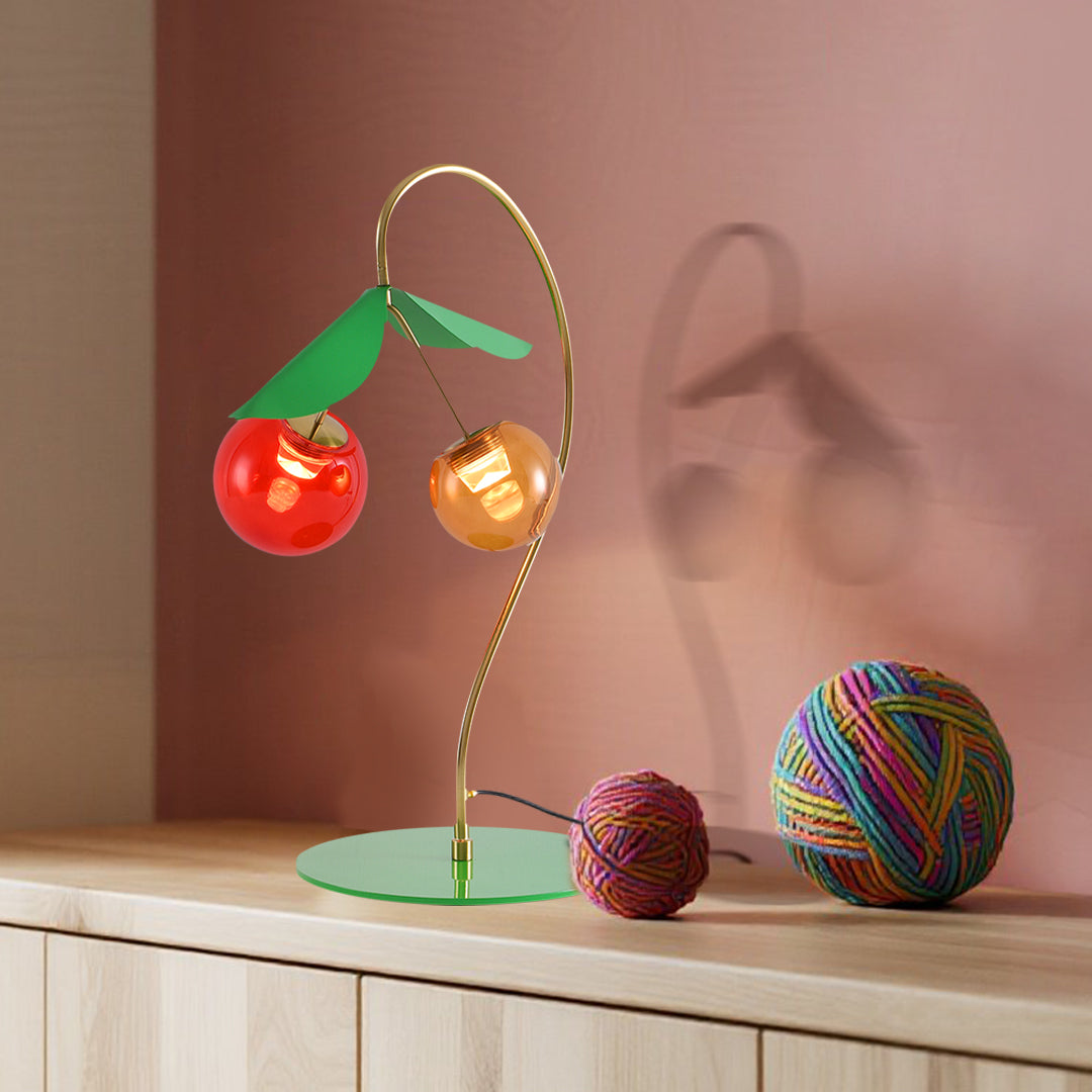 Designer modern LED table lamps featuring dual-color glass spheres on sleek brass stand
