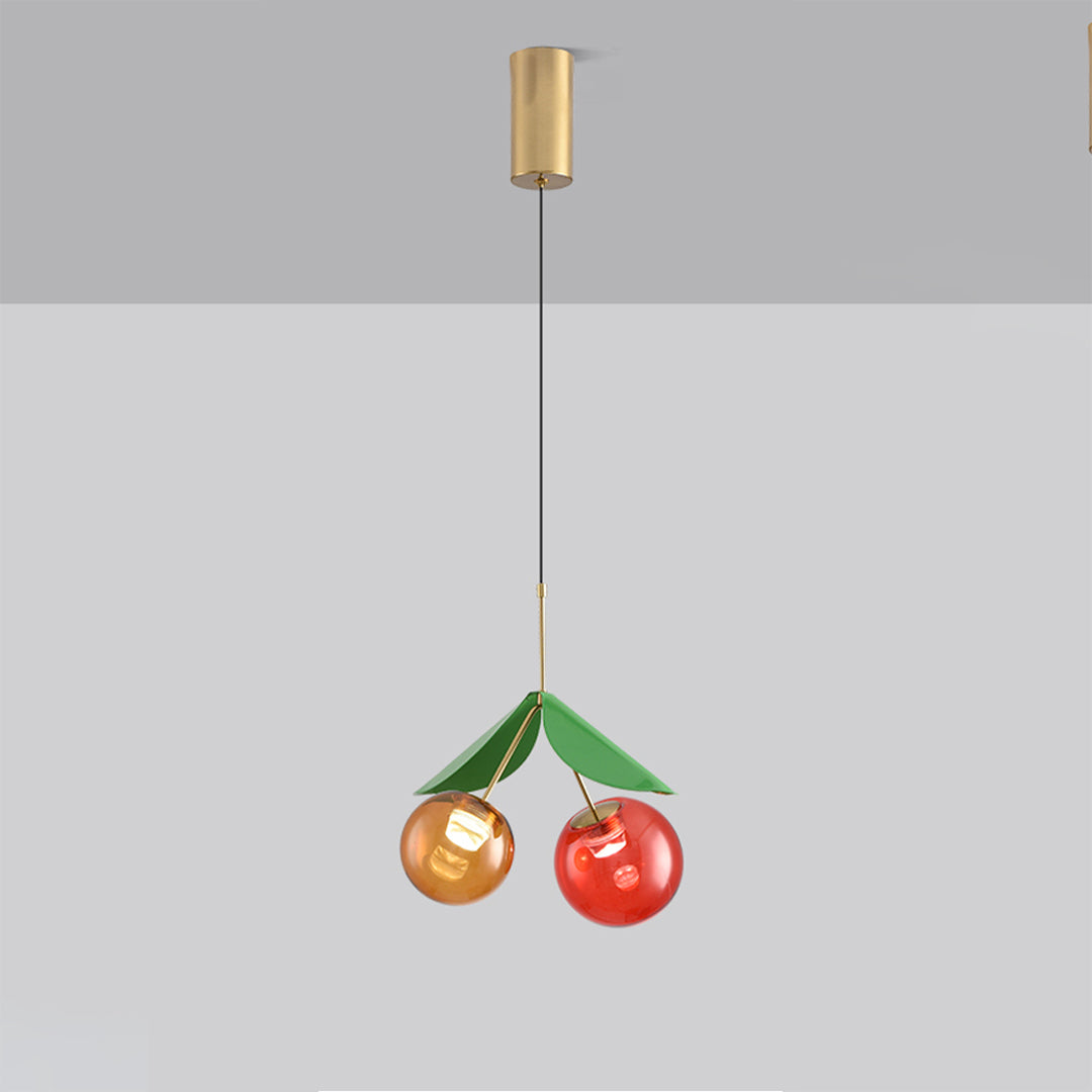 Designer glass globe pendant light fixture showcasing dual fruit-inspired orbs with leaf details
