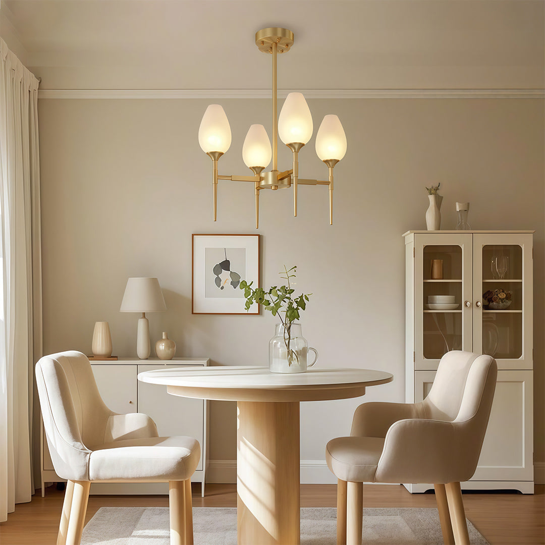 Designer glass modern chandelier featuring glass shade chandelier styling providing warm ambient lighting in contemporary dining interior.