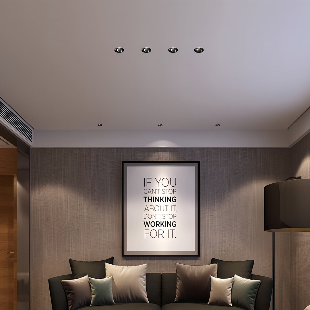 Designer indoor LED spotlight with glass shade chandelier influence providing sophisticated illumination in luxury bedroom suite.