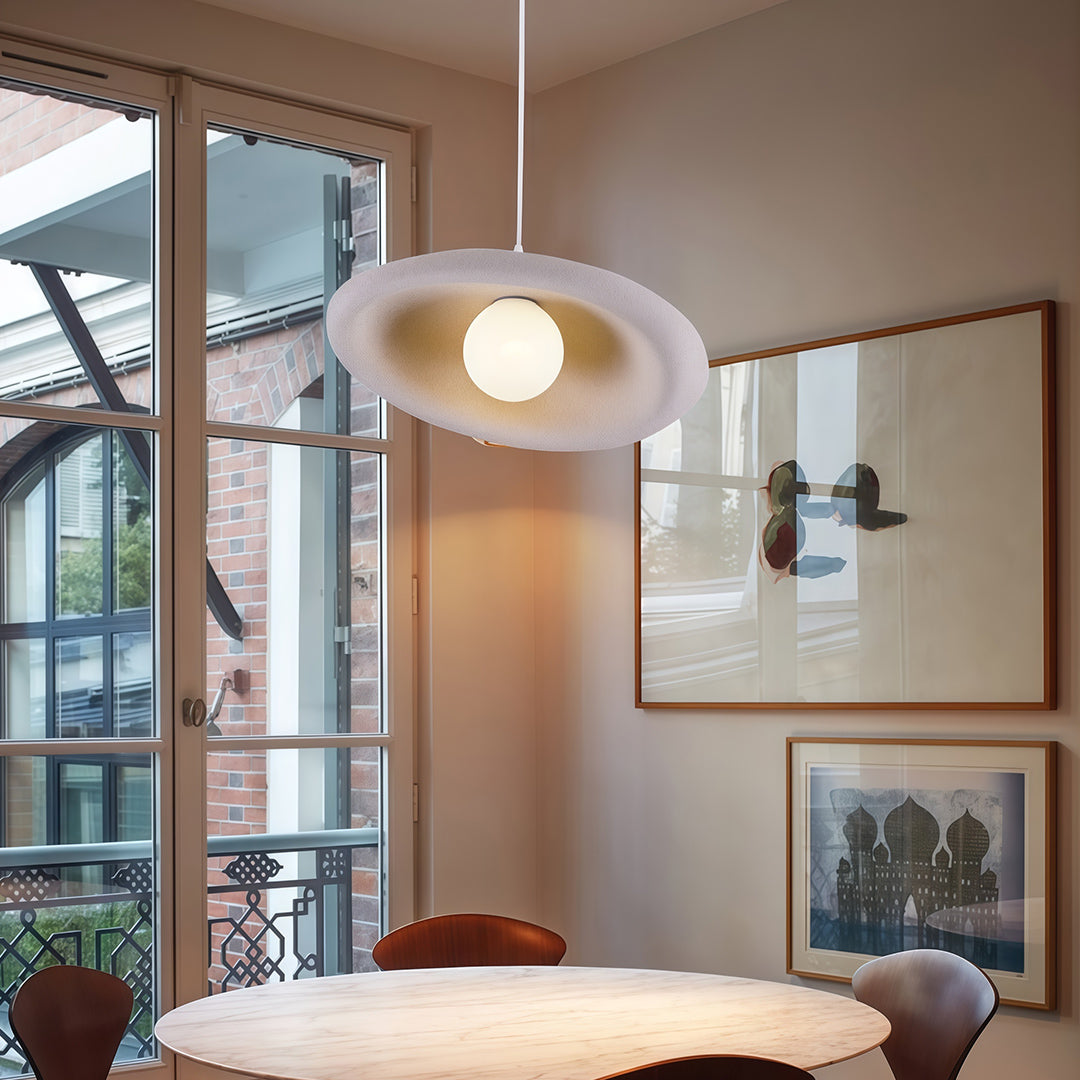 Designer Japanese pendant lights with glass shade chandelier aesthetic in white disc configuration illuminating contemporary living space.