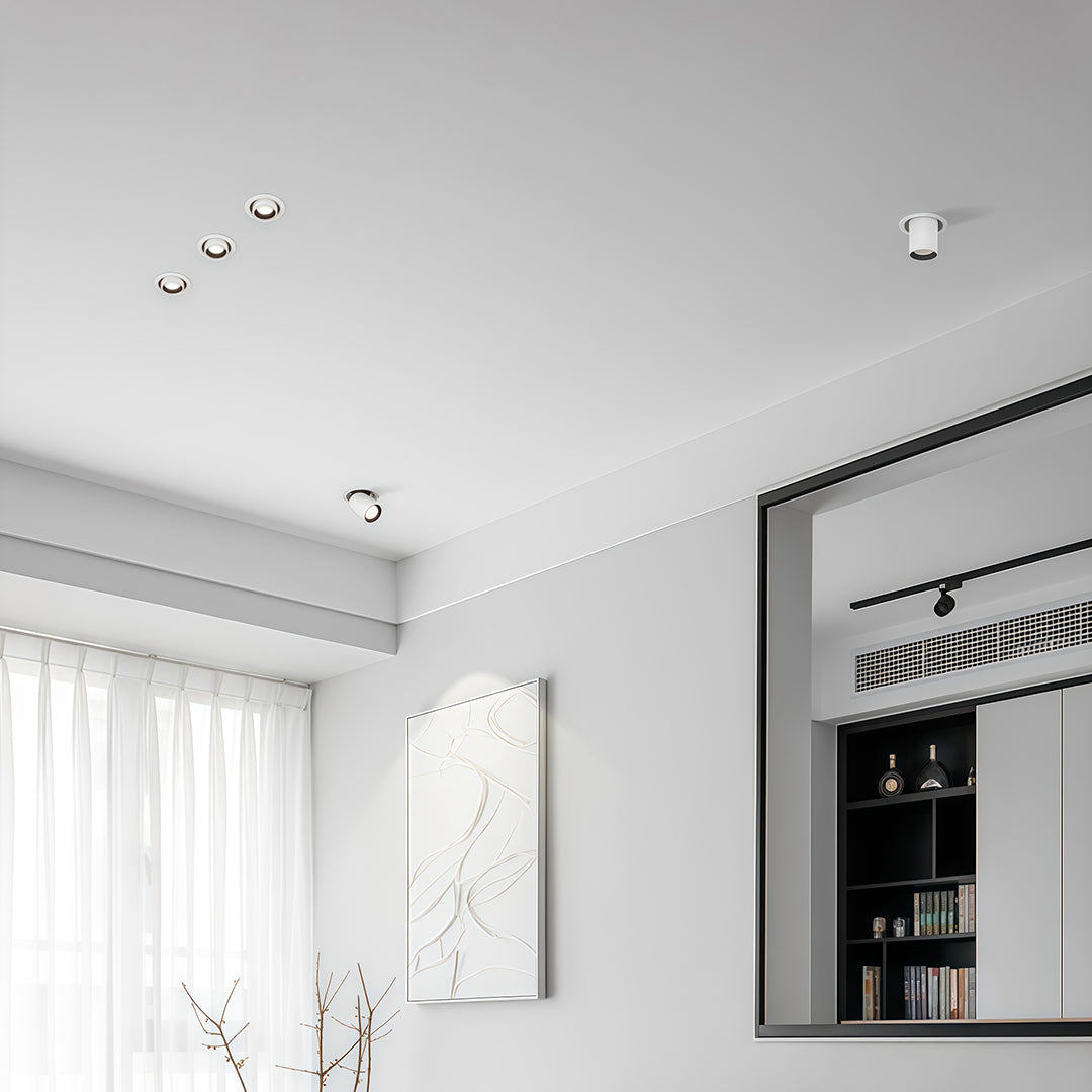 Designer LED indoor spotlights featuring glass shade chandelier inspired lighting in sophisticated white interior space.