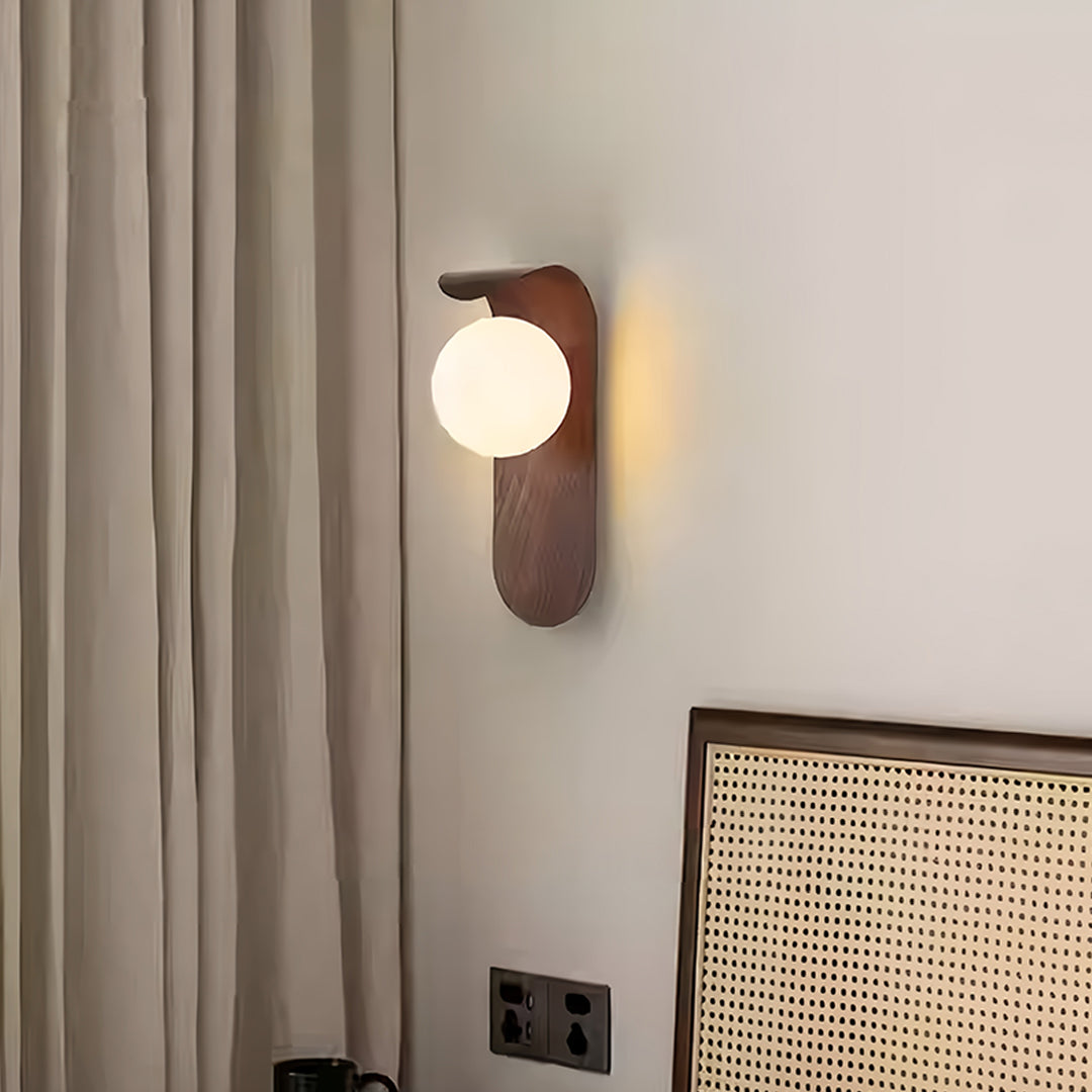 Designer led lights for wall with spherical shade creating perfect ambient glow in bedroom
