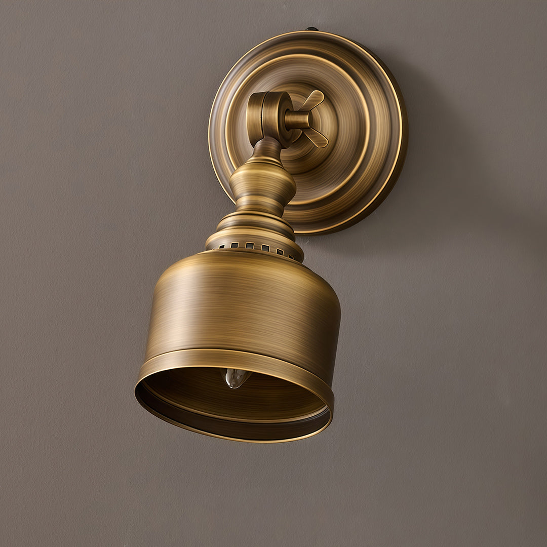 Designer LED wall light lamp featuring glass shade chandelier aesthetic shown on gray wall with vintage brass patina.