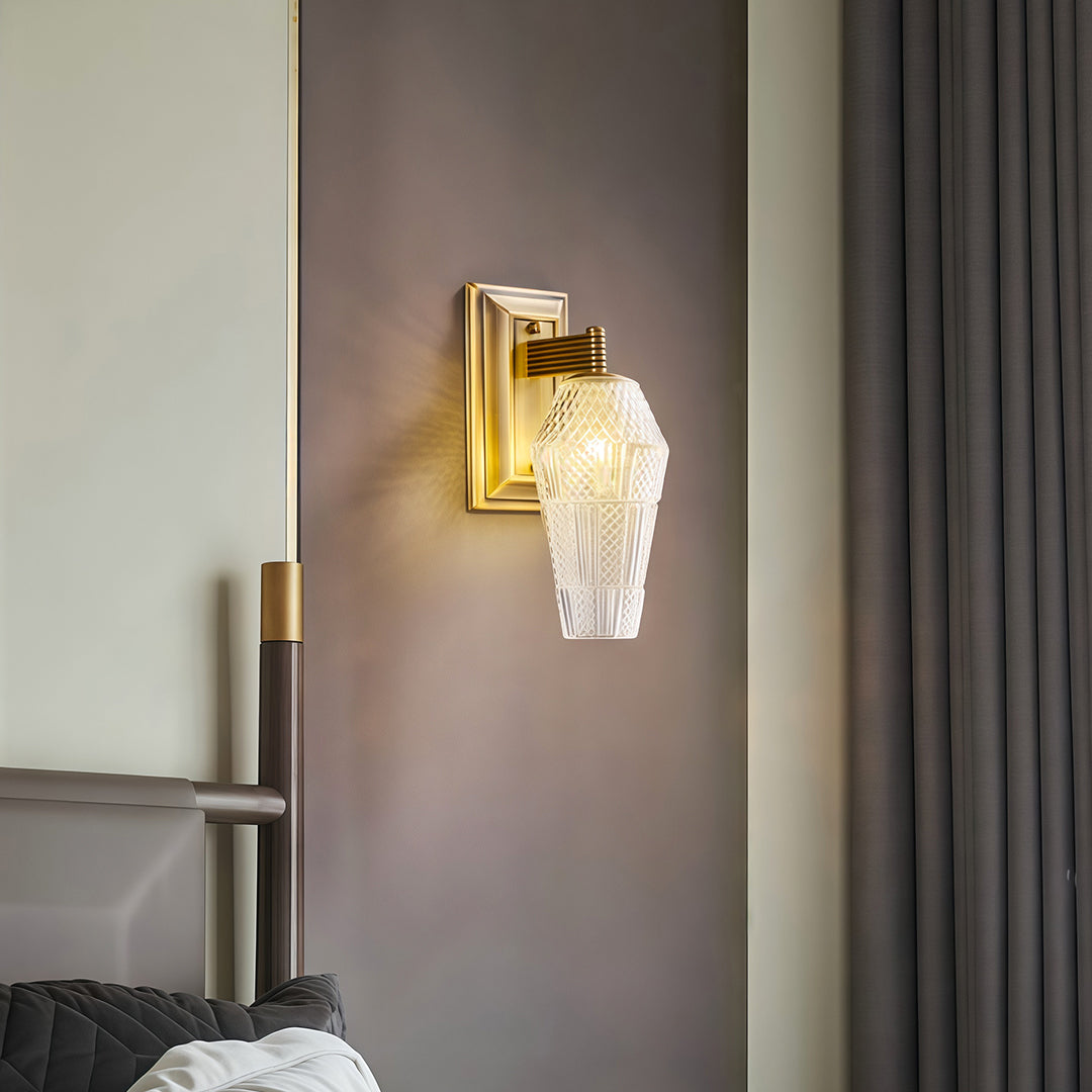 Designer LED wall sconce lights with glass shade chandelier aesthetic illuminating contemporary bedroom with minimalist decor.